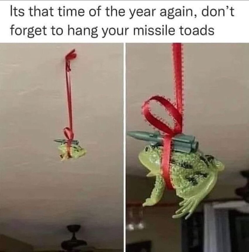 Don't forget to hang your missile toads. (A toy toad and a toy missile hang from a ribbon.) Don't forget to hang your missile toads. (A toy toad and a toy missile hang from a ribbon.)