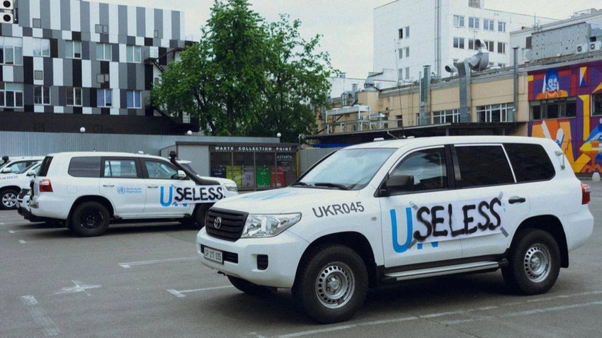 People in Kyiv took UN trucks and taped cardboard signs to them, so instead of 'UN' they say 'Useless'.