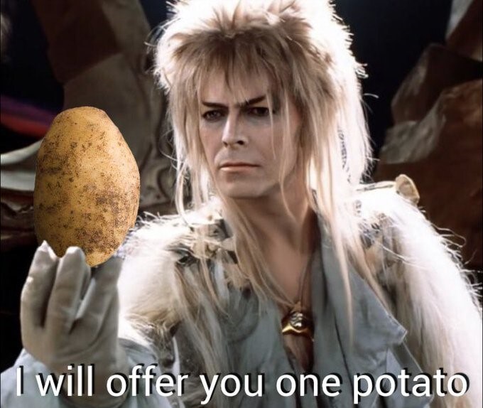David Bowie as Jareth from Labyrinth, holding a potato, says, 'I will offer you one potato.'