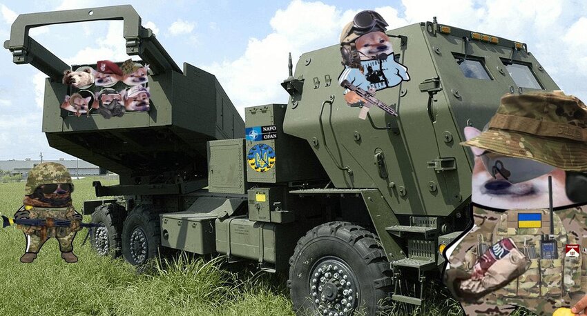 A HIMARS with fellas to the left of it, fellas to the right of it, fellas in the driver's seat, and fellas in the launch tubes.