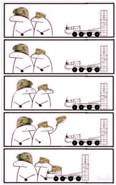 Flork of Cows characters give a hat to a missile launcher.