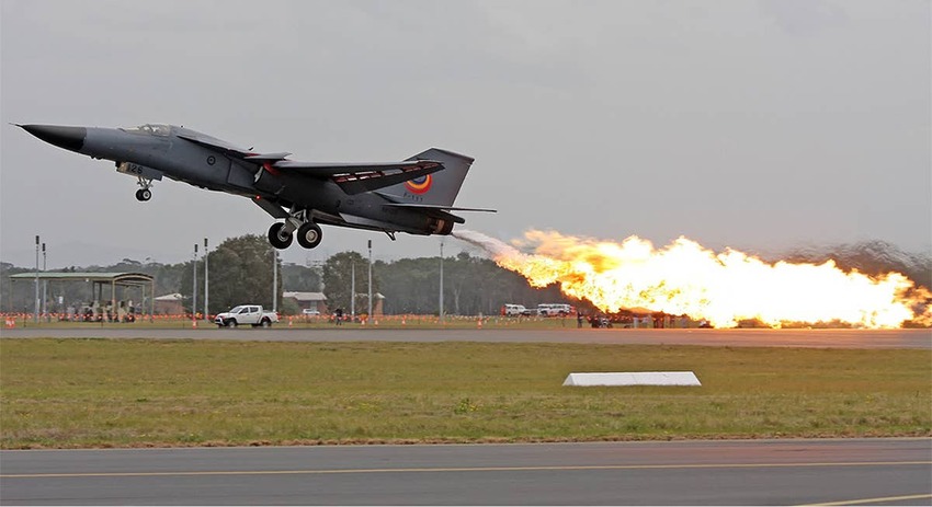 F-111 doing a fuel dump and ignite, spraying large amounts of fire.