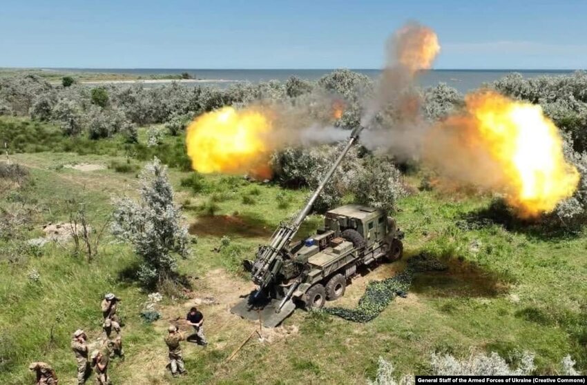 Artistic shot of Ukrainian-designed Bohdana howitzer firing.