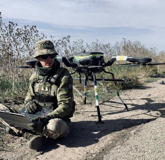 Ukrainian soldier with a Danish demining drone and a Toughbook.
