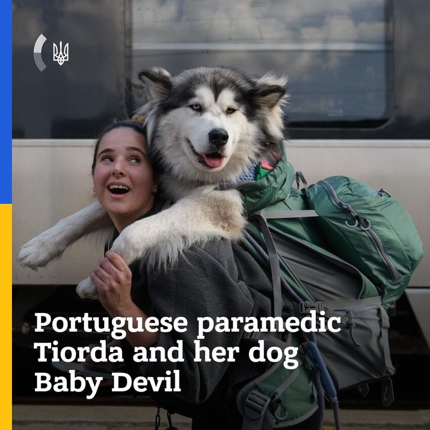 Portugese paramedic Tiorda and her dog Baby Devil (woman carrying a big husky on her back.)
