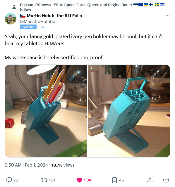 Your gold-plated ivory pen holder may be cool, but it can't beat my tabletop HIMARS.