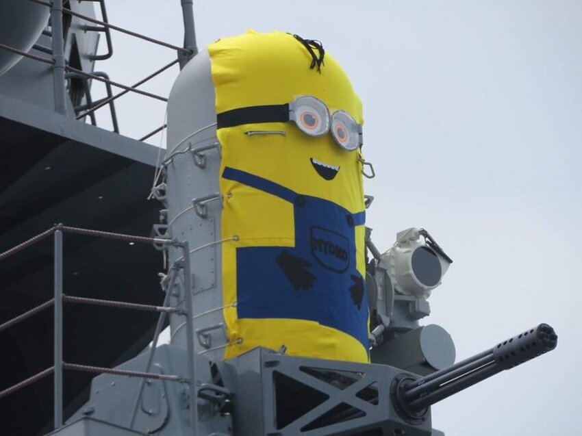 A minigun dressed up like a Minion from 'Despicable Me'.