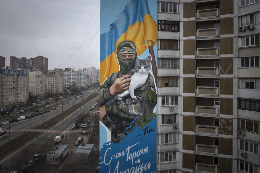Mural showing a soldier with a cat in Ukraine.