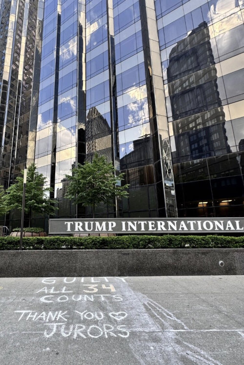 Outside Trump International, someone wrote on the sidewalk 'Guilty all 34 counts, thank you jurors'