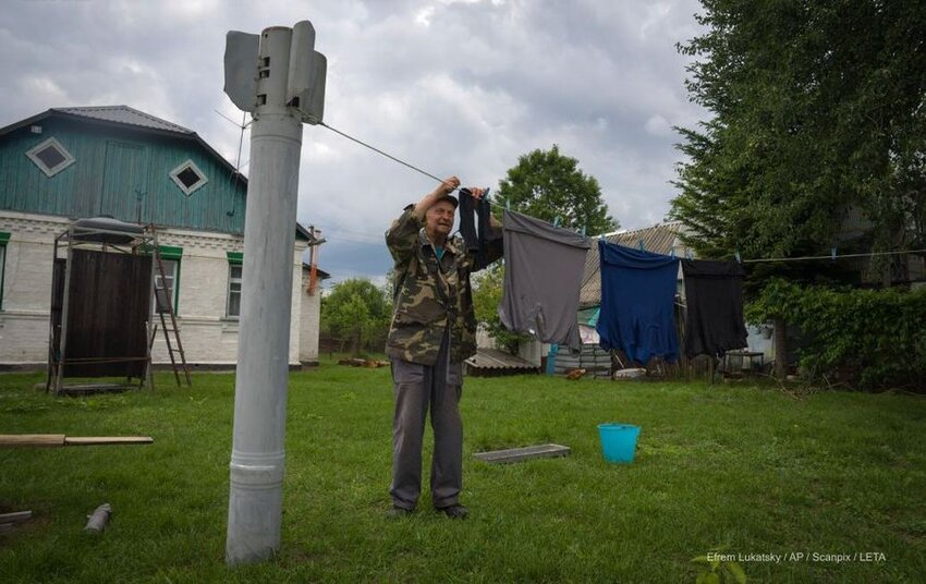 A downed Russian missile is used to string a laundry line.
