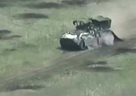 Don't ride on top of an armored vehicle.