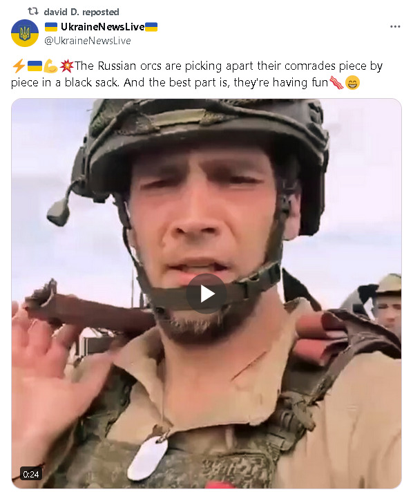 Russians carrying a dead soldier.