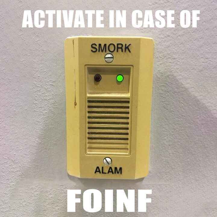 Industrial control panel labeled 'Smork Alam' captioned 'Press in case of foinf'