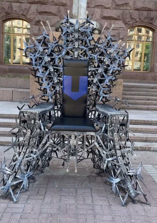 A throne like the Iron Throne from Game of Thrones made out of drones.