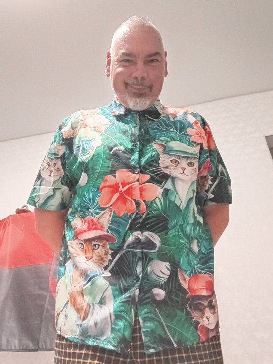 Medic Zero in a Hawaiian shirt with a bunch of cats on it.