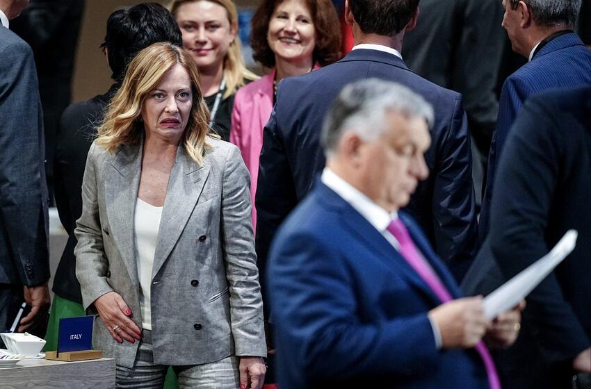 Italian PM Giorgia Meloni looking angry at Viktor Orban.