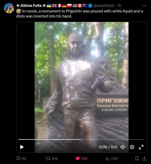 Tweet where Russians poured white liquid over a statue of Prigozhin and put a dildo into his hand.
