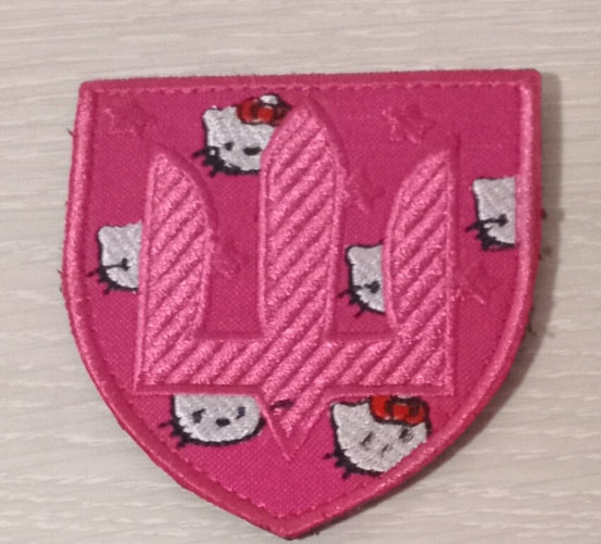 A Hello Kitty pink patch with a tryzub.