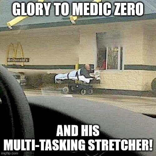 Glory to Medic Zero and his multi-tasking stretcher! (A guy in a stretcher at what looks like a fast-food drive through.)