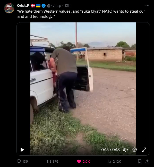 Russian says 'We hate Western values!' and pushes a woman out of a car.
