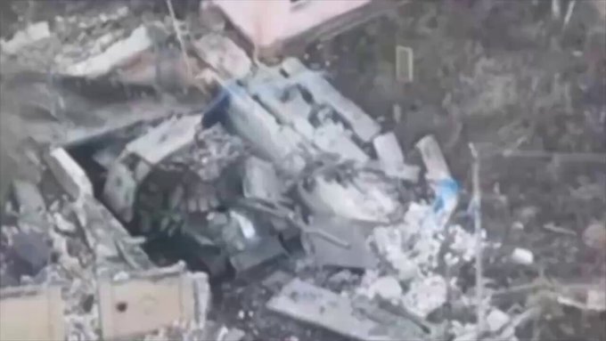 A Russian tank on fire, which a crewman attempted to put out. Unsuccessfully.