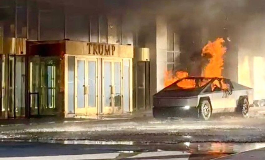 A Tesla Cybertruck on fire in front of a Trump hotel.