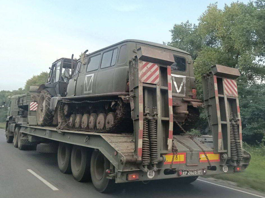 A rare tracked Bukhanka Russian vehicle on a transport truck.